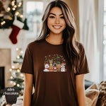 Woman wearing a Christmas Cats Group / Holiday Cat Squad Shirt, featuring festive cat designs in a cozy holiday setting.