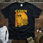 Corn – ’Cause Porn Is Frowned Upon Shirt displayed on a black tee with fun corn graphic and vibrant colors.