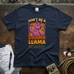 Don’t Be a Drama Llama – Save the Drama for Your Mama Shirt on a wooden table with musical accessories.