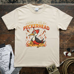 Don’t Be a Peckerhead Shirt featuring a cartoon woodpecker design on a cream t-shirt, perfect for everyday wear.