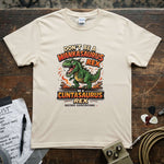 Don't Be a Wankasaurus Rex Shirt featuring a T-Rex design with vibrant colors on a soft beige tee.