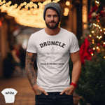 Druncle – Fueled by Fun Since Forever Shirt worn by a man, festive background with holiday lights.