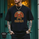 Guess What Turkey Butt Shirt featuring a colorful turkey graphic on a black premium tee.