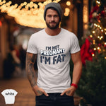 I'm Not Pregnant, I'm Fat Shirt worn by a man in casual setting, surrounded by lights and greenery.