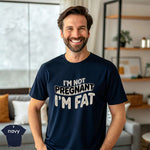 I’m Not Pregnant, I’m Fat Shirt worn by a smiling man in a navy tee, showcasing premium quality fabric and fun design.