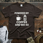 Powered by Coffee and WD-40 Shirt on a brown tee with coffee and WD-40 graphics.