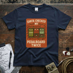 Santa Checked My Pedalboard Twice Shirt displayed on a navy tee with colorful pedal graphics and festive accents.