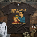 Today Is Slap an Idiot Day – Gonna Be Really Busy Shirt featuring a comic-style graphic with vibrant colors.