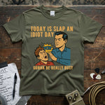 Today Is Slap an Idiot Day – Gonna Be Really Busy Shirt with comic-style graphic on olive green tee.