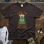 Turn the Fuzz Up It's Cold Outside Shirt on a rustic wooden table, showcasing vibrant design and premium quality.
