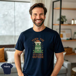 Turn the Fuzz Up It's Cold Outside Shirt on a smiling man in a navy tee, showcasing vibrant DTG print.