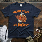 Wanna Stuff My Turkey Shirt featuring a cartoon turkey chef on a navy tee, perfect for Thanksgiving.