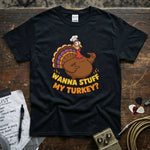 Wanna Stuff My Turkey Shirt featuring a fun turkey graphic on a black tee, perfect for Thanksgiving celebrations.