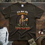 I’m Not An Alcoholic I’m At The Bar | Funny Drinking Humor T-Shirt displayed on a dark tee with a cartoon character.
