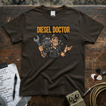 Diesel Doctor | Funny Diesel Mechanic Workwear T-Shirt featuring a mechanic with tools and a playful expression.