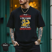 I’m a Mechanic I Fix Cars | Funny Mechanic Superpower T-Shirt on a model in black, showcasing humor and style.