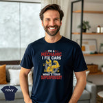 I’m a Mechanic I Fix Cars | Funny Mechanic Superpower T-Shirt on a smiling man in a navy tee.