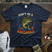 Image of a navy shirt featuring a humorous fish design with the text 