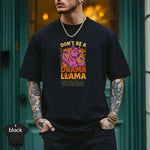 Don’t Be a Drama Llama – Save the Drama for Your Mama Shirt showcased by model in urban setting wearing a black tee.