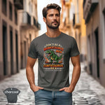Model wearing Don't Be a Wankasaurus Rex Shirt in charcoal, showcasing vibrant design and modern fit.