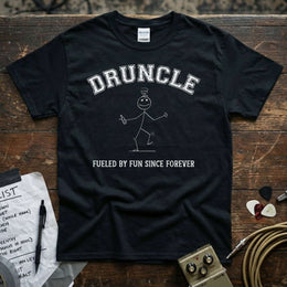 Druncle – Fueled by Fun Since Forever Shirt displayed on a wooden table with music accessories.