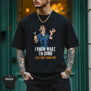 I Know What I’m Doing I Just Don’t Know Why | Funny Mechanic T-Shirt worn by a stylish man outdoors.