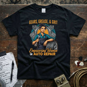 Gears Grease & Grit | Empowering Women in Auto Repair T-Shirt featuring a woman mechanic with tools and tires.