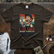 I Fix Cars Because I’m Hopeless at Relationships | Funny Mechanic T-Shirt design featuring a quirky mechanic with a wrench.