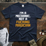 I'm a Mechanic, Not a F**ing Magician Shirt displayed on a navy tee, showcasing vibrant printed text.
