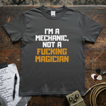 I'm a Mechanic, Not a F**ing Magician Shirt displayed on a premium gray tee by Lucky Spark.