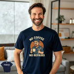 Man wearing No Coffee No Repairs Mechanic Shirt, smiling in a modern living room setting.