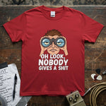 Oh Look, Nobody Gives a Shit Shirt featuring a humorous design with binoculars on a vibrant red tee.