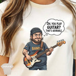 Oh You Play Guitar That’s Adorable | Funny Bass Player Shirt featuring a cartoon bassist with a playful expression.