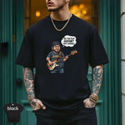 Oh You Play Guitar That’s Adorable | Funny Bass Player Shirt worn by a musician with tattoos, showcasing a playful design.