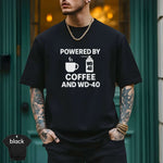 Powered by Coffee and WD-40 Shirt displayed on a model, featuring a modern fit and vibrant DTG print.