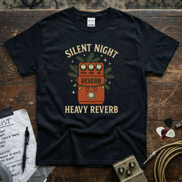 Silent Night Heavy Reverb Shirt displayed on a black tee with vibrant DTG print and guitar accessories in the background.