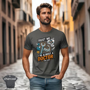 Trust Me I’m Almost a Doctor for Cars | Funny Mechanic T-Shirt showcased on a model in a city street.