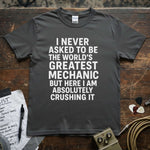 World’s Greatest Mechanic Shirt featuring bold text on a gray premium tee from Lucky Spark.